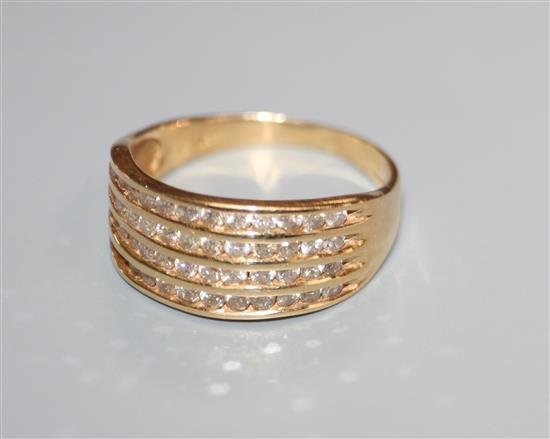 A diamond and 18ct gold half-hoop ring with four lines of channel-set diamonds, size Q.